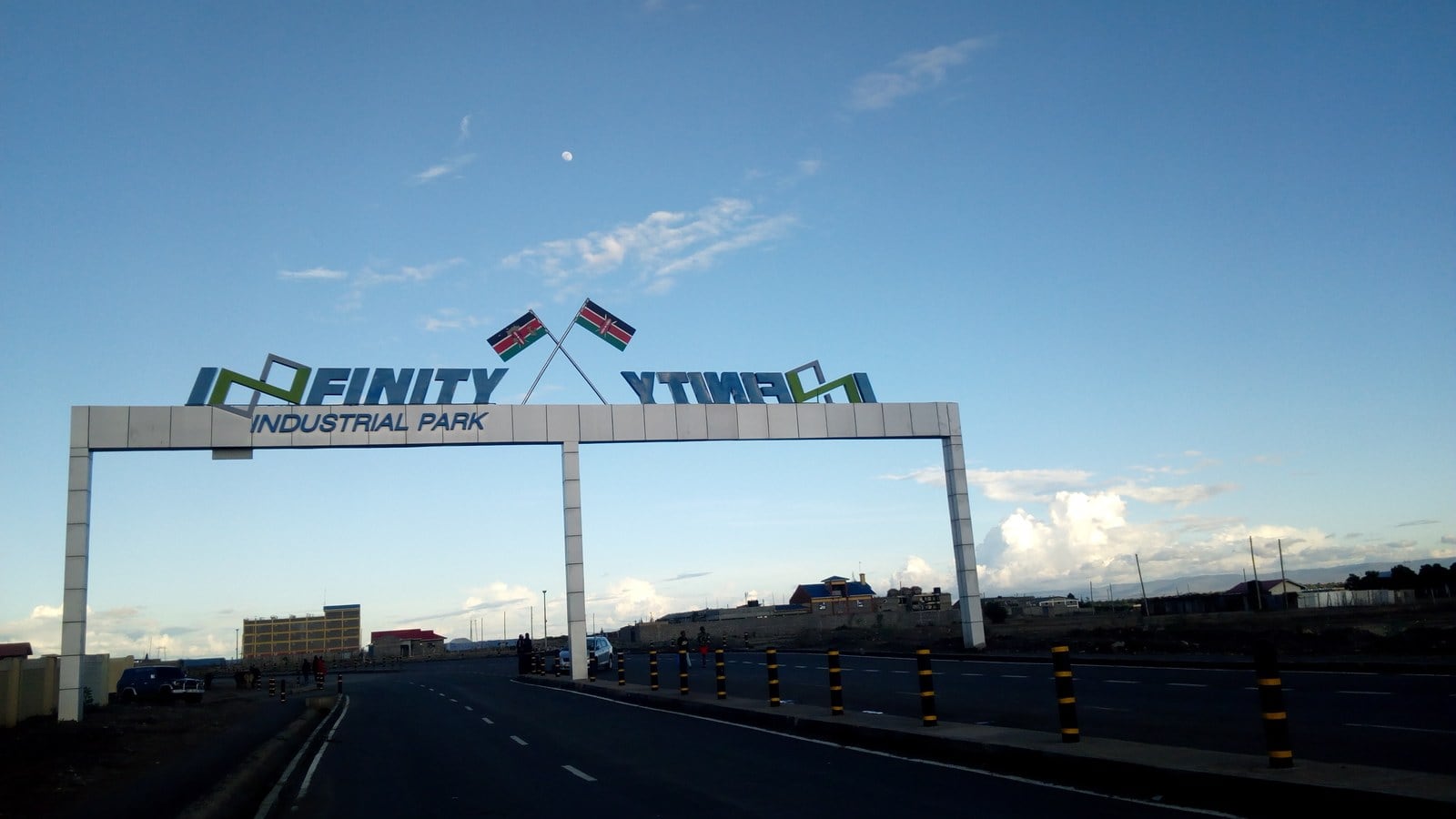 The entrance arch of Infinity Industrial Park on Nairobi's Eastern Bypass, with two Kenyan flags