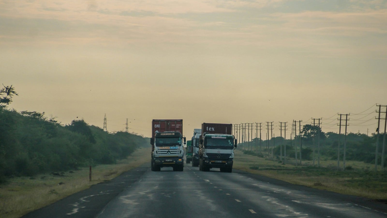 Container lorries driving on a highway in Kenya